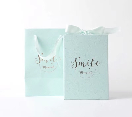 Cosmetic Package Coated Paper Foldable Box With Ribbon Hot Stamping